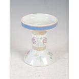 A Chinese porcelain famille rose candle stand, Qing Dynasty, decorated with lotus scroll, 9cm