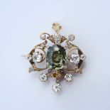 A Victorian green sapphire and diamond set brooch/ pendant, centred with a rectangular cushion