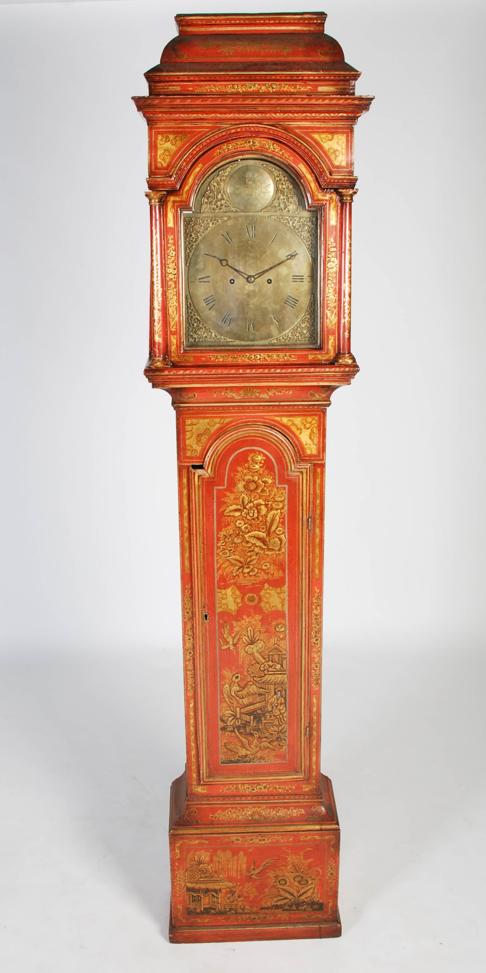 A George III red lacquer longcase clock, unsigned, the brass dial with Roman numerals, the twin