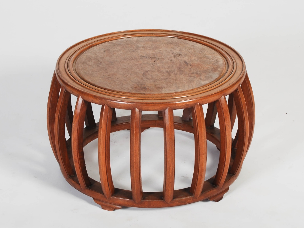 A Chinese dark wood and burr wood drum shaped jardiniere stand, the circular top with a burr wood