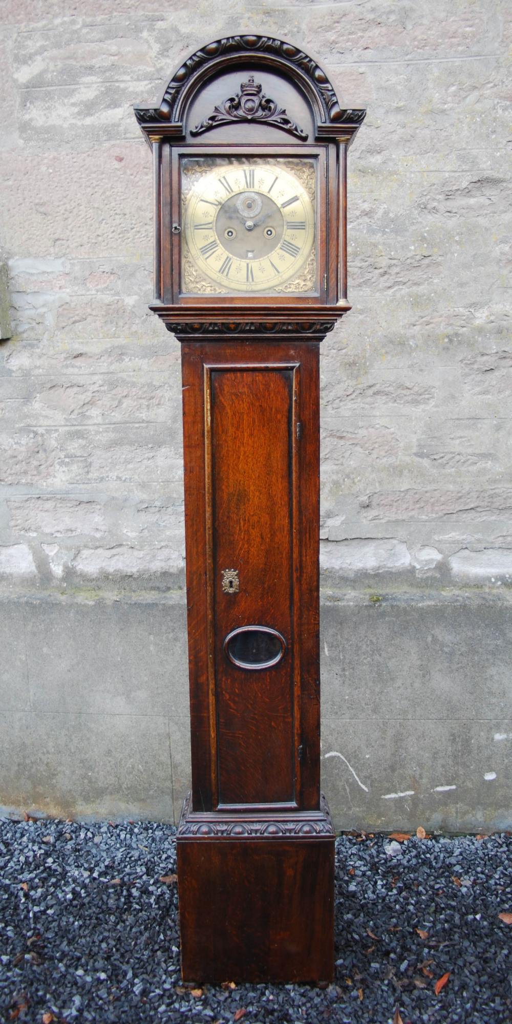 An 18th century and later oak longcase clock, Tho. Kilgoure, Invernese, the brass dial and brass