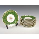 A set of thirteen Coalport fruit plates, decorated with printed and hand coloured foliate sprays