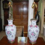 A pair of Samson porcelain famille rose style gilt metal mounted vases, later mounted as three light