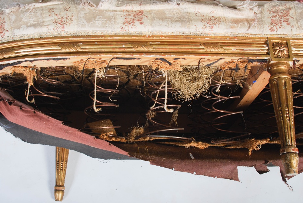 A late 19th century gilt wood sofa, the reeded top rail centred with flower and foliate carved - Image 15 of 17