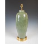 A Chinese porcelain celadon vase mounted as a table lamp, decorated with incised flowers and