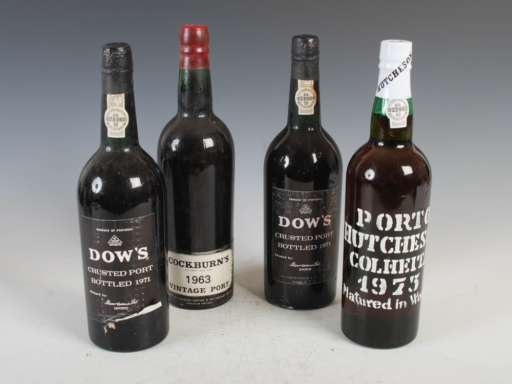 Four bottles of vintage port, comprising; one bottle of Cockburn's Vintage Port 1963, two bottles of
