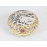A Chinese porcelain yellow ground circular shaped box and cover, bearing Qianlong seal mark but