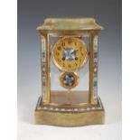 A late 19th century French brass, onyx and champleve enamel mantle clock, the circular dial with