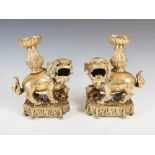 A pair of Chinese gilt metal shishi joss stick holders/ incense burners, late 19th/ early 20th