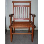 An early 20th century Scottish pine armchair, with planked seat, on rectangular section supports