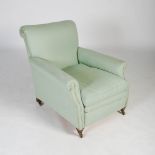 An Edwardian mahogany armchair in the style of Howard & Sons, the green upholstered back, arms and