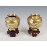 A pair of Chinese gilt metal vases, late 19th/ early 20th century, decorated with rectangular shaped