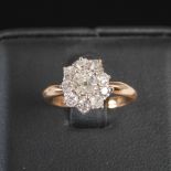 A 19th century diamond cluster ring, centred with a round old cushion cut diamond estimated to weigh