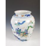 A Chinese porcelain wucai jar, decorated with warriors and pine trees under a border of peony, 44.