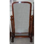 A Victorian mahogany cheval mirror, the rectangular mirror plate enclosed by spiral turned