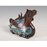 A Chinese bronze and cloisonne enamel box and cover in the form of a recumbent horse, Qing