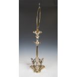 A Victorian silver plated column lamp base, on concave platform base with three winged mask