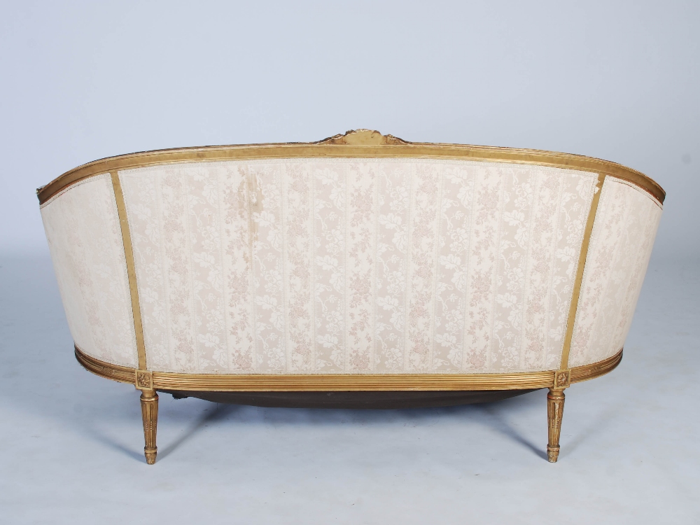 A late 19th century gilt wood sofa, the reeded top rail centred with flower and foliate carved - Image 10 of 17