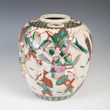 A Chinese porcelain crackle glazed jar, Qing Dynasty, decorated with warriors, within diaper and