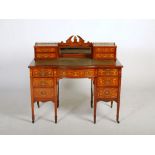 A late 19th century rosewood and marquetry knee hole desk, the upright gallery back centred with a