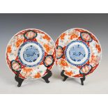 A pair of Japanese Imari lobbed plates, Meiji Period, decorated with a central roundel enclosing