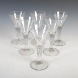 Six assorted oversized 18th century wine glasses, with conical shaped bowls, raised on clear glass