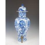 A Chinese porcelain blue and white jar and cover converted to a cistern, Qing Dynasty, decorated