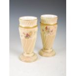 A pair of Royal Worcester ivory ground vases, dated 1893, decorated with flowers and foliage, the