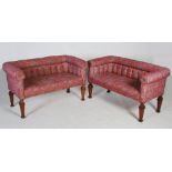 A pair of early 20th century mahogany sofas, the floral upholstered button down backs, arms and seat