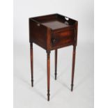 An early 19th century mahogany bedside locker, the square top with three quarter gallery and two