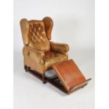 An early 20th century mahogany invalids wing armchair, 'FOOT'S PATENT' by J. FOOT & SON LTD., the