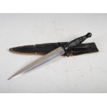 A Fairbairn- Skyes post war Commando fighting knife, J. Nowill & Sons, Sheffield, with black leather