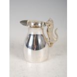 A late 20th century silver cream jug, Birmingham, 1989, makers mark of PN, the handle formed as a