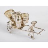 A Chinese silver plated novelty cruet set in the form of figure pulling a rickshaw, late 19th/ early