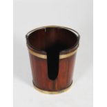 A late 18th/19th century Irish mahogany and brass bound plate bucket, of tapered cylindrical form