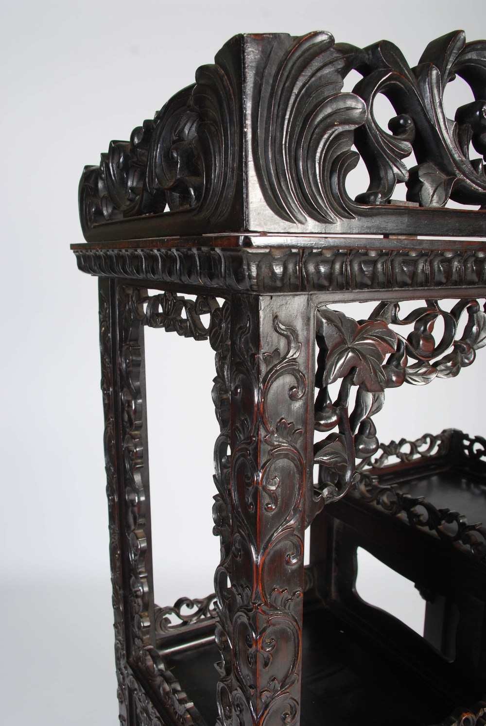 A Chinese dark wood display cabinet, Qing Dynasty, the pierced and scroll carved foliate frieze - Image 2 of 8