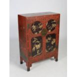A Chinese red lacquer side cabinet, Qing Dynasty, the rectangular top with incised decoration of