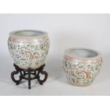 A large pair of modern Chinese porcelain fish bowls, 20th century, decorated with pairs of