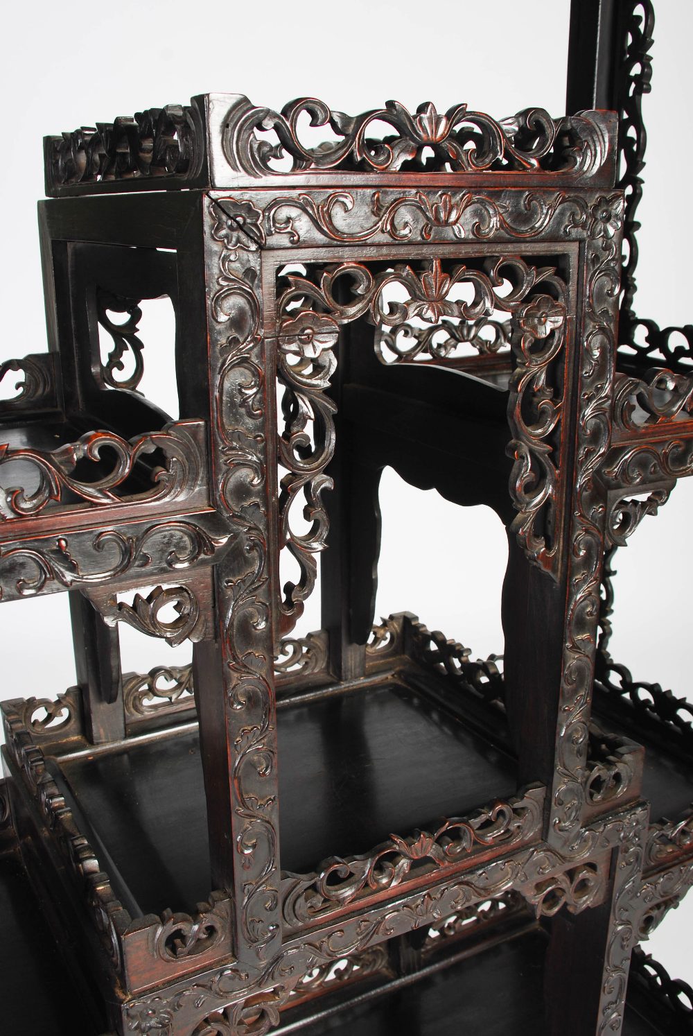 A Chinese dark wood display cabinet, Qing Dynasty, the pierced and scroll carved foliate frieze - Image 6 of 8