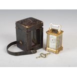 A late 19th/ early 20th century French brass and champleve enamel miniature carriage clock, the