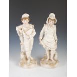 A pair of late 19th/ early 20th century bisque porcelain figures, modelled as young boy holding pond