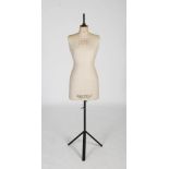 A vintage Yugin & Sons Ltd., fabric and painted wood mannequin, on black painted metal stand with