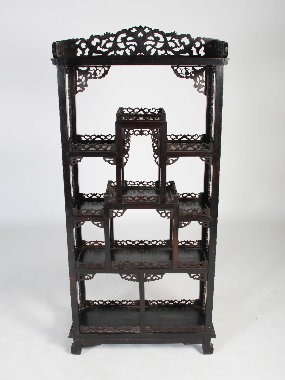 A Chinese dark wood display cabinet, Qing Dynasty, the pierced and scroll carved foliate frieze - Image 7 of 8