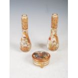 A pair of Japanese Satsuma pottery vases and a Satsuma pottery circular shaped box and cover,