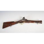 An early 19th century flintlock blunderbuss, the lock plate dated 1815, the walnut stock with