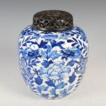 A Chinese porcelain blue and white jar and wood cover, late Qing Dynasty, decorated with a pair of