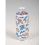 A Chinese porcelain blue, white and red snuff bottle, decorated with bats and cloud scrolls, six