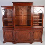 A 19th century mahogany breakfront bookcase, the moulded cornice and dentil frieze above a central