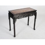 A Chinese dark wood centre table, Qing Dynasty, the rectangular top with a mottled red marble insert
