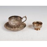 A 19th century Middle Eastern silver cup and saucer, together with a 19th century Chinese white